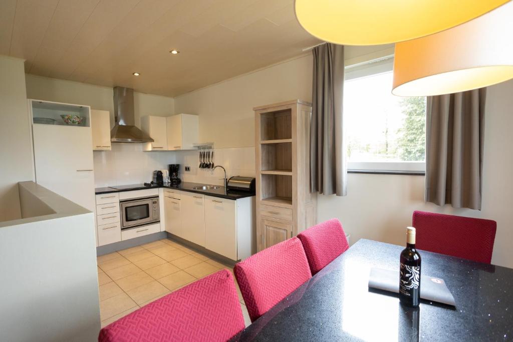 Kuchyň nebo kuchyňský kout v ubytování Holiday Park La Sapinière