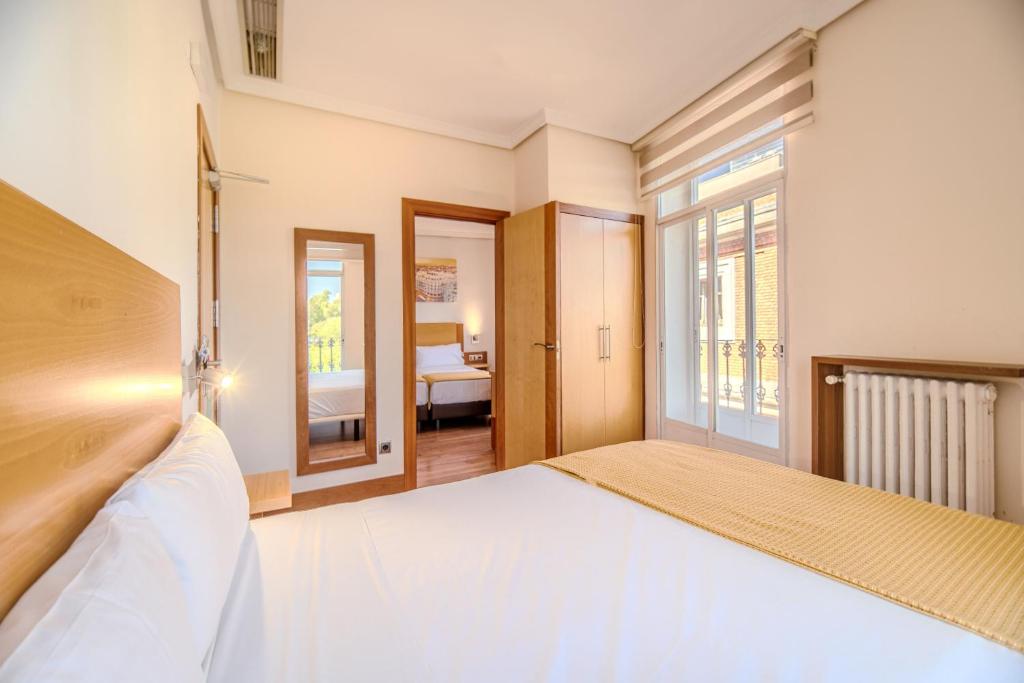 Cama o camas de una habitación en ITC Mora by Soho Boutique