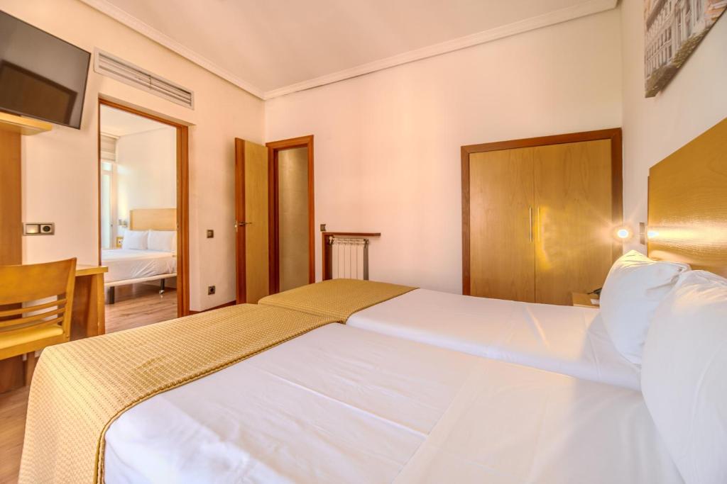 Cama o camas de una habitación en ITC Mora by Soho Boutique