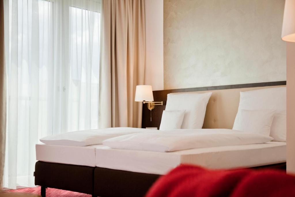 Postel nebo postele na pokoji v ubytování Gold Palais Hotel