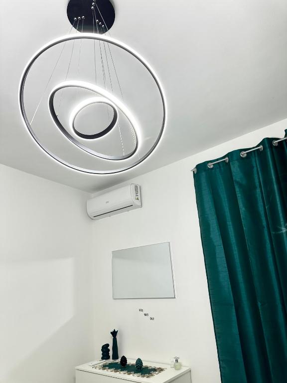 a bathroom with a light hanging from the ceiling at Armonia dell'Etna in Santa Venerina