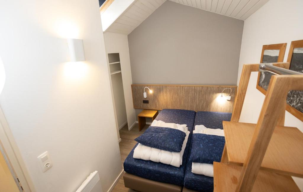 Postel nebo postele na pokoji v ubytování Holiday Park La Sapinière
