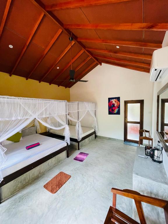 Postel nebo postele na pokoji v ubytování Mango Tree House