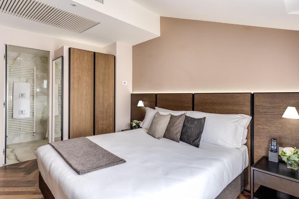 Postel nebo postele na pokoji v ubytování Plinius Lifestyle Hotel Lake Como