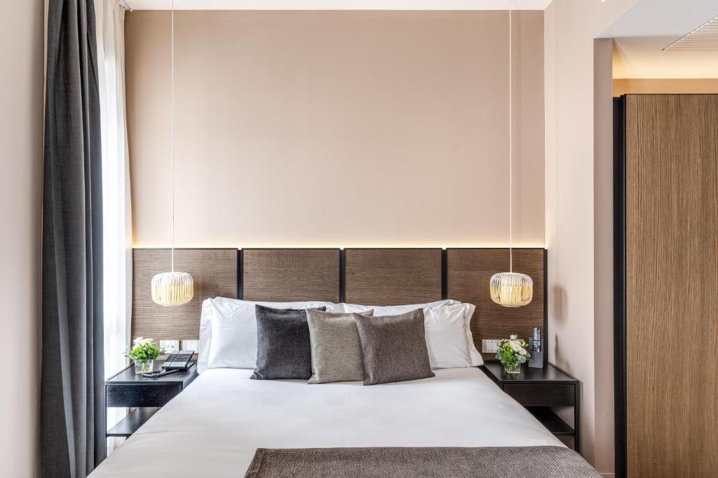 Postel nebo postele na pokoji v ubytování Plinius Lifestyle Hotel Lake Como