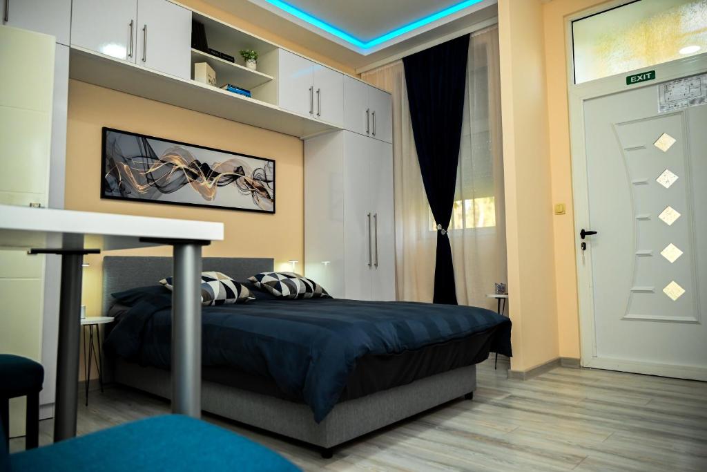 Postel nebo postele na pokoji v ubytování Blue apartment