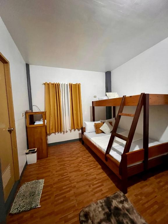 Postel nebo postele na pokoji v ubytování Eighty8 Tourist Inn