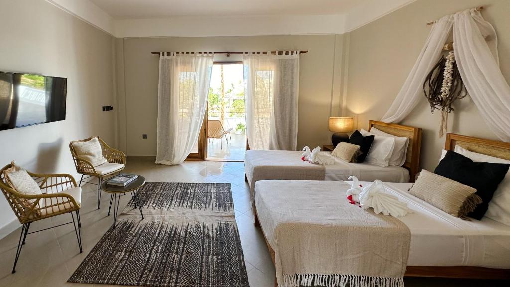 Postel nebo postele na pokoji v ubytování Kaskazi Hotel Zanzibar