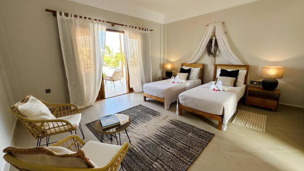 Postel nebo postele na pokoji v ubytování Kaskazi Hotel Zanzibar