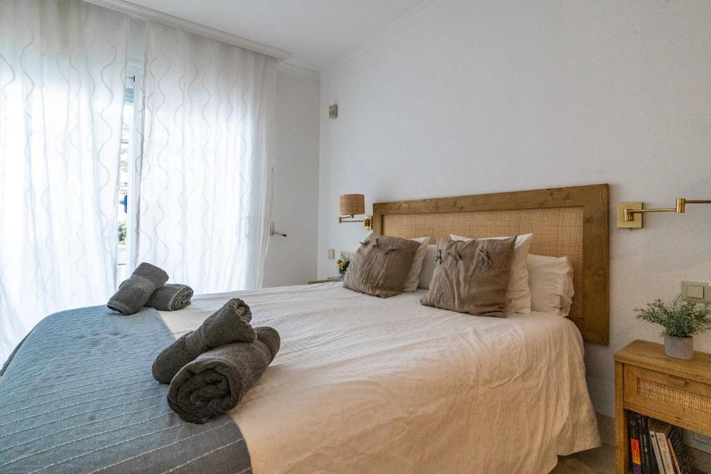 Postel nebo postele na pokoji v ubytování White Pearl Beach Elviria