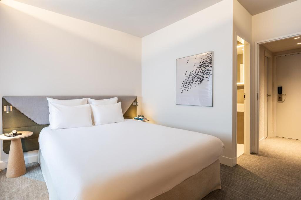 Postel nebo postele na pokoji v ubytování Novotel Brugge Centrum