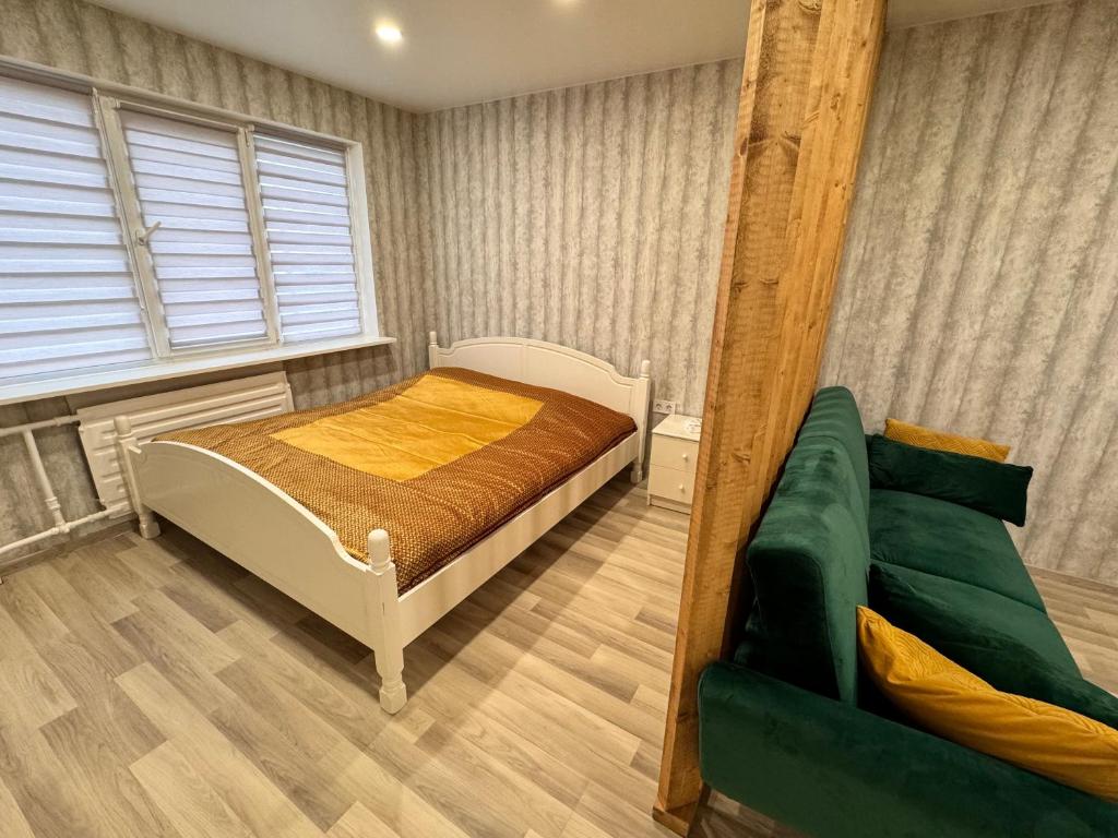 Postel nebo postele na pokoji v ubytování Tall61 Apartment