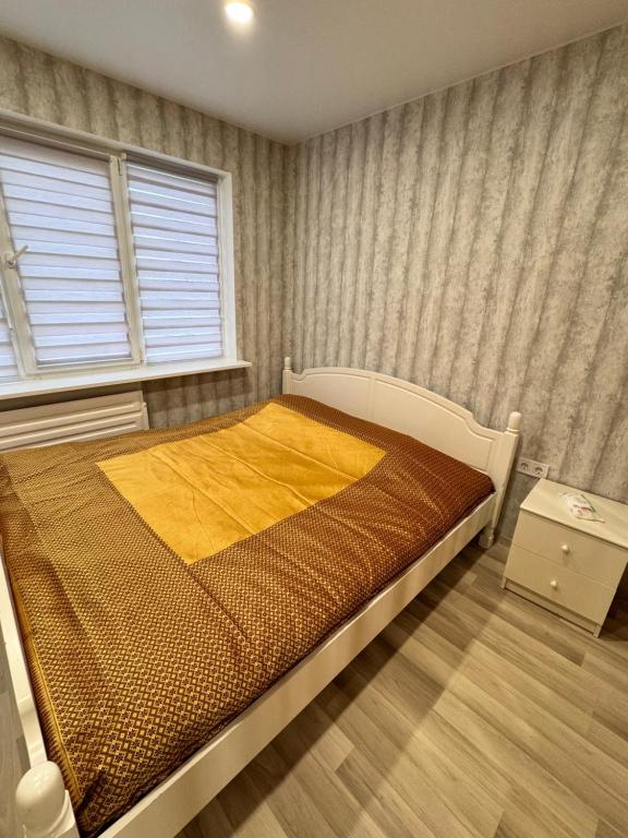 Postel nebo postele na pokoji v ubytování Tall61 Apartment