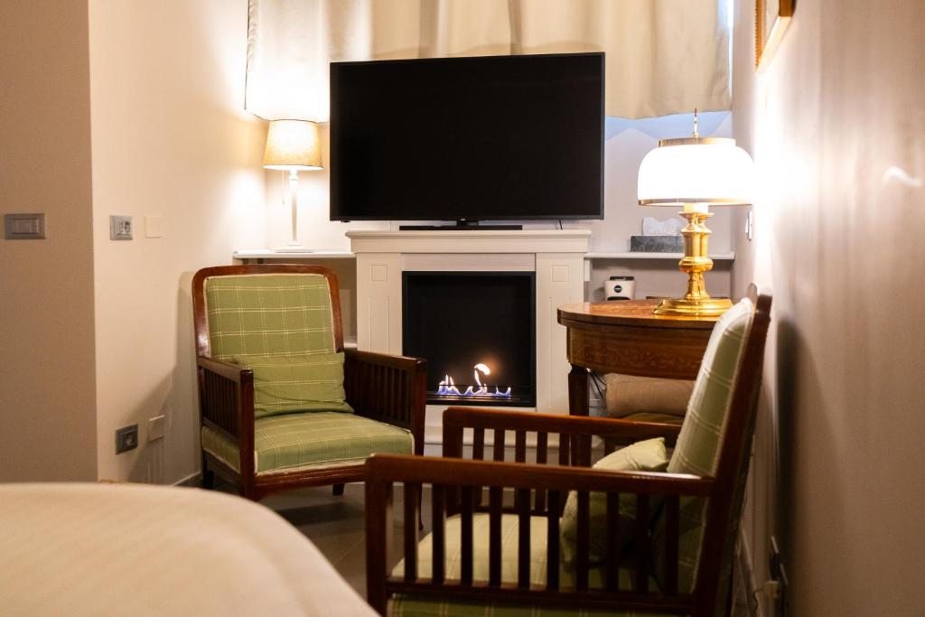 TV a/nebo společenská místnost v ubytování L'Olivo Country Resort & SPA
