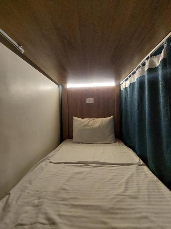 A bed or beds in a room at Minerva Grand Boutique