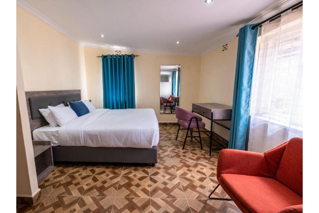 Postel nebo postele na pokoji v ubytování Kongoni House