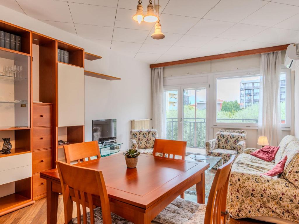 a living room with a table and a couch at Apartment SunnyLake by Interhome in Riva del Garda