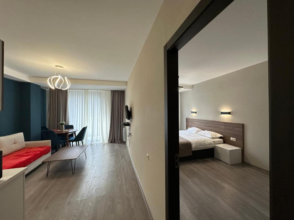 Postel nebo postele na pokoji v ubytování Kristal bakuriani Resort C block 202
