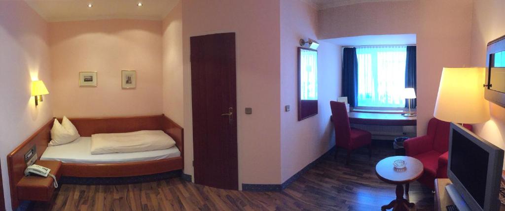 Postel nebo postele na pokoji v ubytování Hotel Carmen