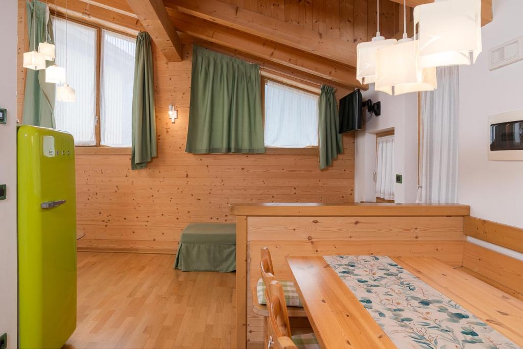 TV a/nebo společenská místnost v ubytování Albergo Diffuso Dolomiti