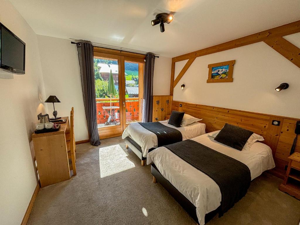 Postel nebo postele na pokoji v ubytování Hôtel Igloo