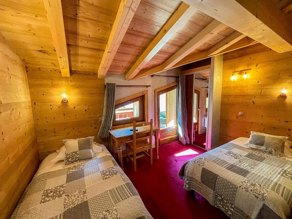 Postel nebo postele na pokoji v ubytování Hôtel Igloo