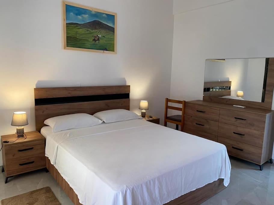 Postel nebo postele na pokoji v ubytování Casa Nelly & Toi JB