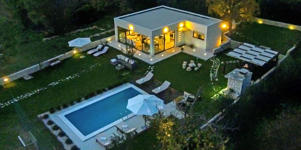 an aerial view of a house with a swimming pool at Luxury Villa Luminosa in Split