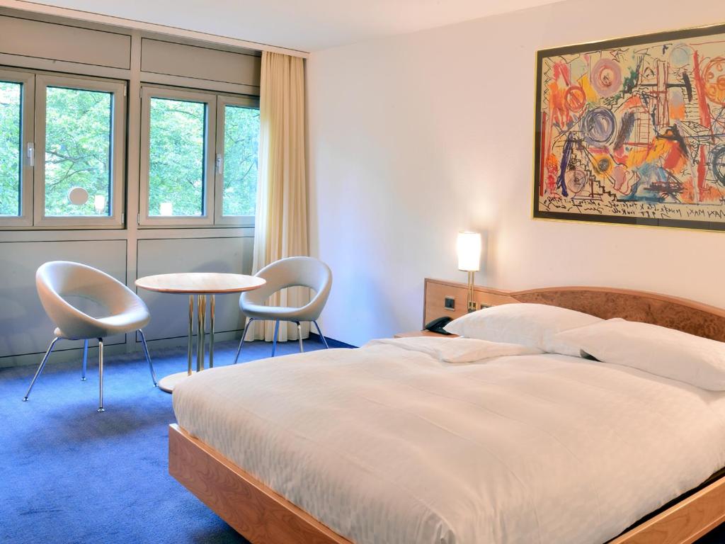 Postel nebo postele na pokoji v ubytování Residence Zug