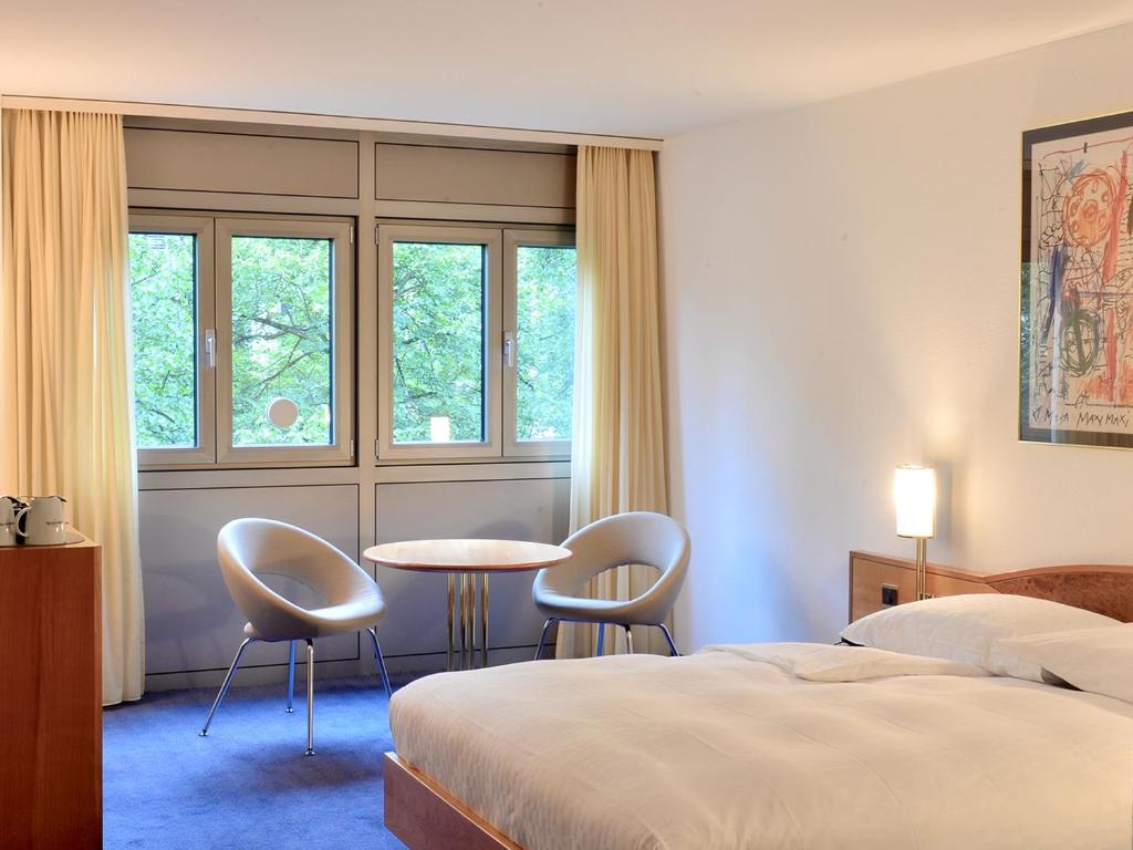 Postel nebo postele na pokoji v ubytování Residence Zug