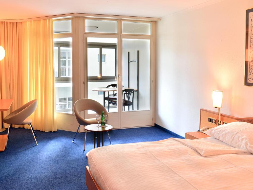 Postel nebo postele na pokoji v ubytování Residence Zug