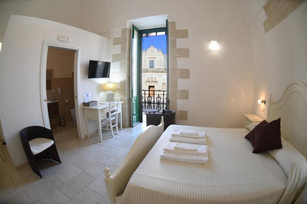 Postel nebo postele na pokoji v ubytování Palazzo Vilei