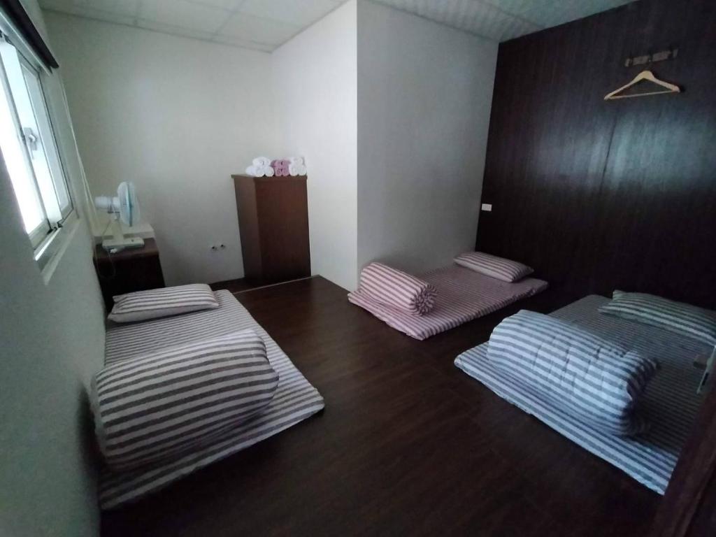 Postel nebo postele na pokoji v ubytování 督督工作室民宿