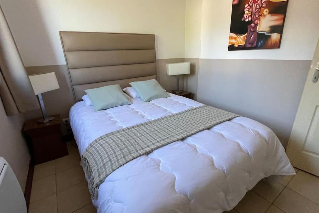 Ένα ή περισσότερα κρεβάτια σε δωμάτιο στο VALBERG aux pieds des pistes et centre station