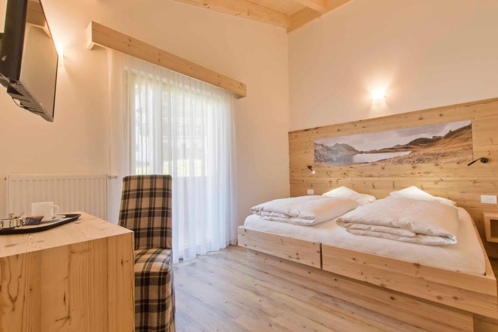 Postel nebo postele na pokoji v ubytování Hotel Steinrösl