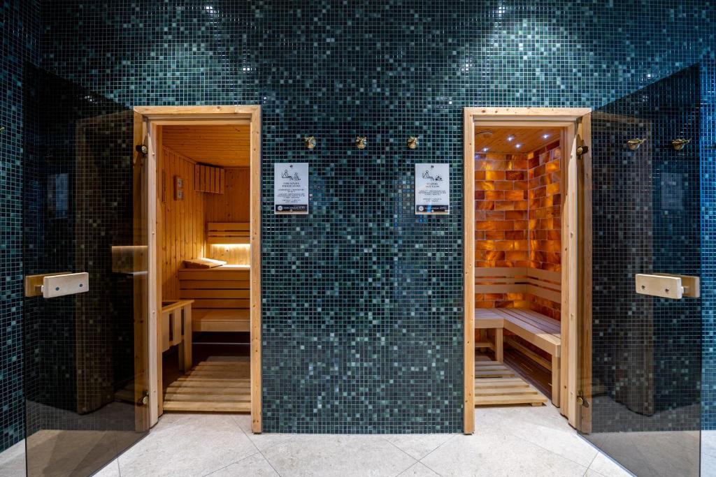 Postel nebo postele na pokoji v ubytování Hungarikum Hotel