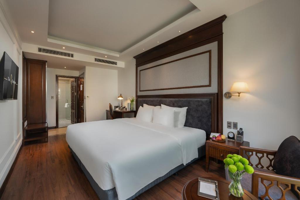 Postel nebo postele na pokoji v ubytování The Q Boutique Hotel