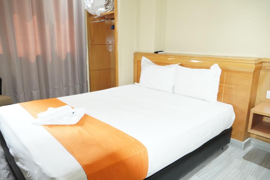 Postel nebo postele na pokoji v ubytování Hotel Golden Flora