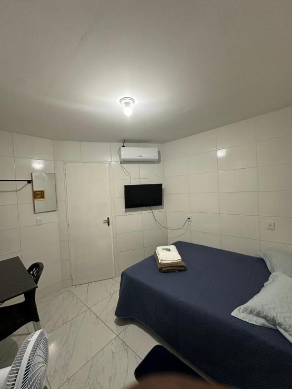 Postel nebo postele na pokoji v ubytování Cantinho Aconchegante- Quarto 03 Família - com AR