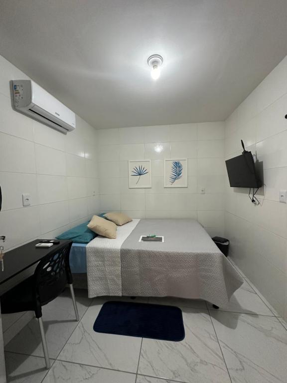 Postel nebo postele na pokoji v ubytování Cantinho Aconchegante - Quarto 04 Ar-condicionado