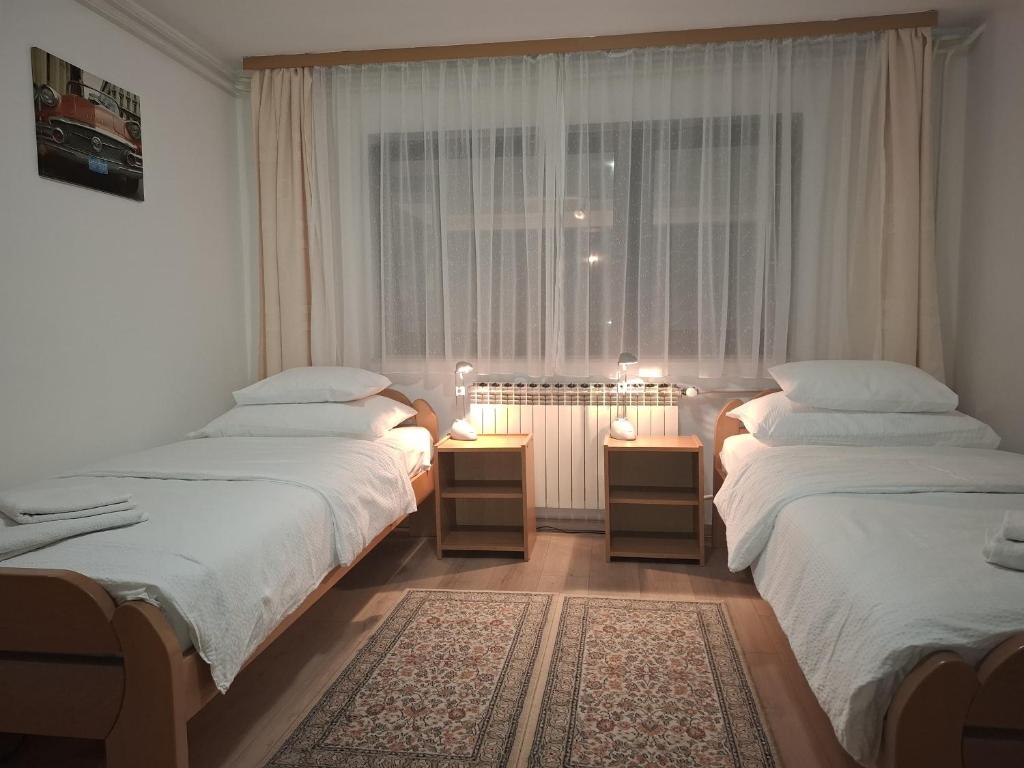 Posteľ alebo postele v izbe v ubytovaní Apartments Maximir