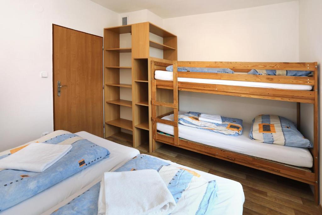 Postel nebo postele na pokoji v ubytování Penzion Skála