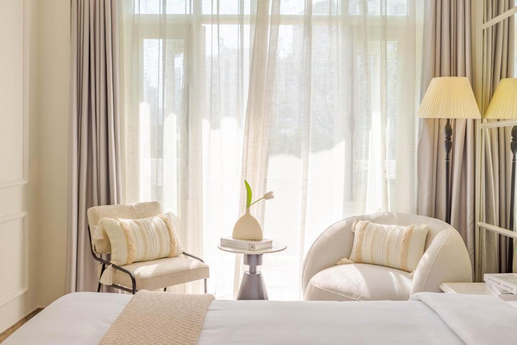 Postel nebo postele na pokoji v ubytování Keypad Hotel - Nhân Hòa