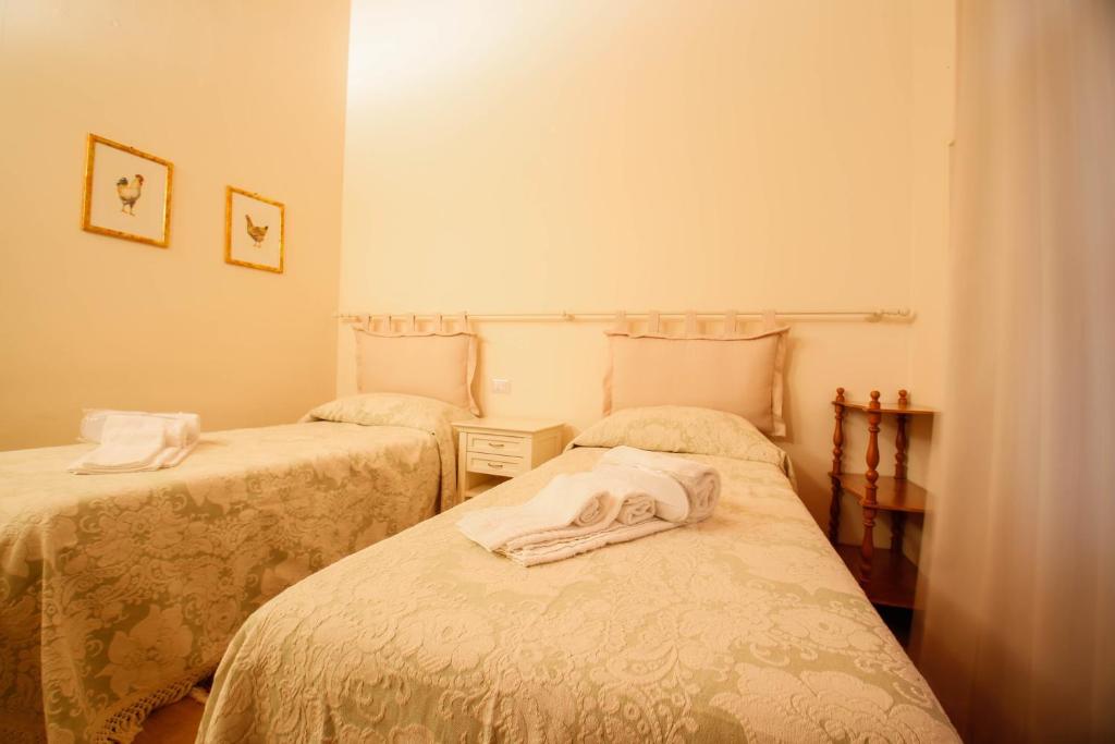 Postel nebo postele na pokoji v ubytování Casa Montecuccoli