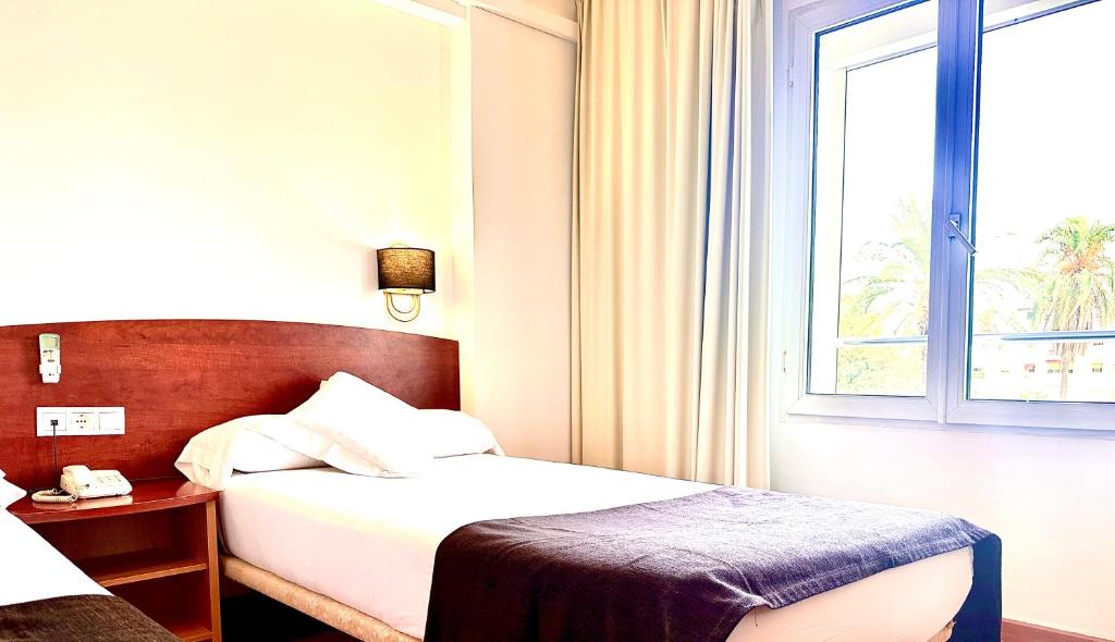 A bed or beds in a room at Arriadh