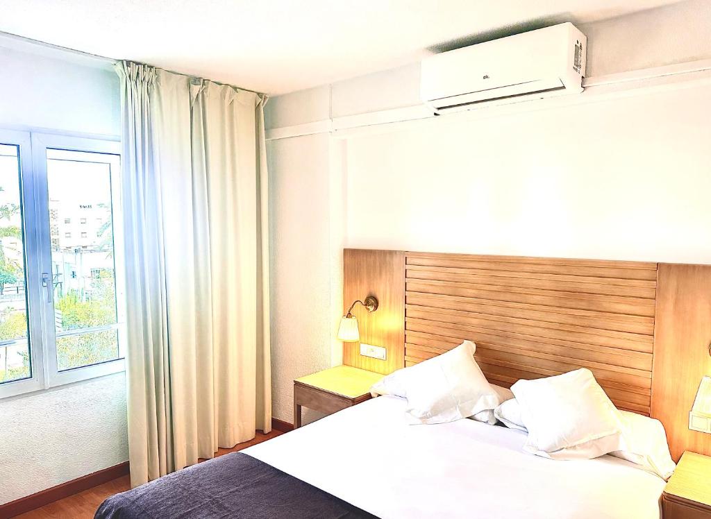 A bed or beds in a room at Arriadh