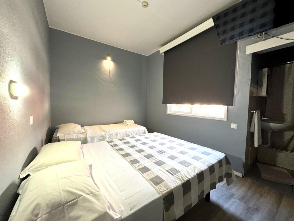 Postel nebo postele na pokoji v ubytování Hostel Monaco