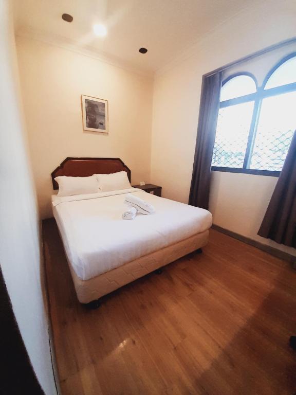 Postel nebo postele na pokoji v ubytování Sogo Hotel 2