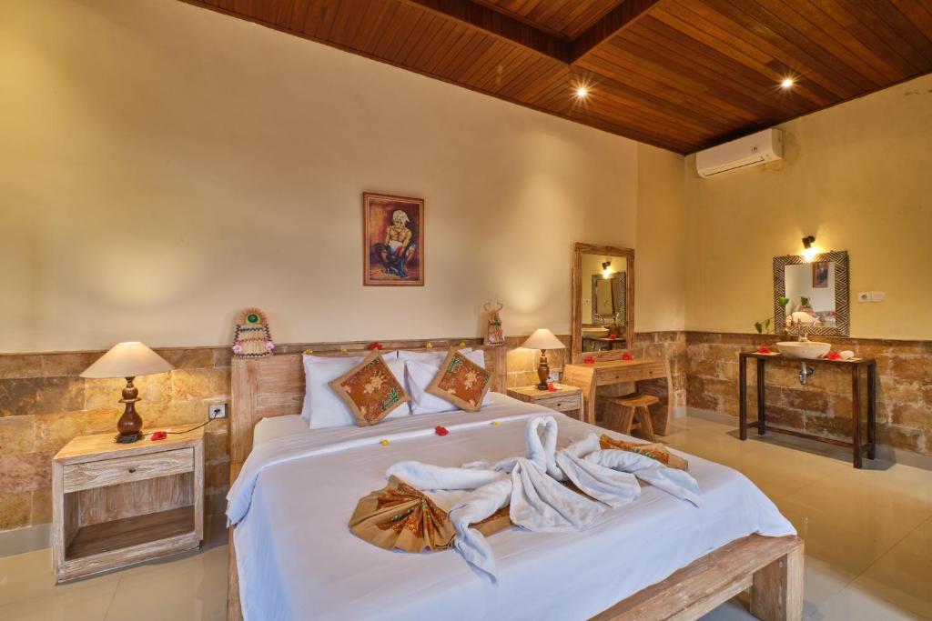 Postel nebo postele na pokoji v ubytování Yamuna Guest House