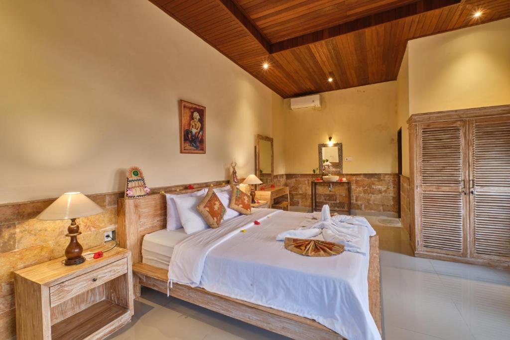 Postel nebo postele na pokoji v ubytování Yamuna Guest House